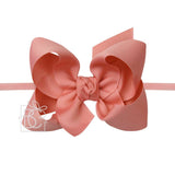 Our elastic pantyhose headbands are made for the most perfect and comfortable fit possible. Soft, flexible, and comfortable for your little one’s head, but a strong enough grip to ensure it stays on no matter what. This quarter-inch one-size headband fits virtually everyone and is available in a variety of stylish colors. Comes attached with a 4.5" Grosgrain Bows